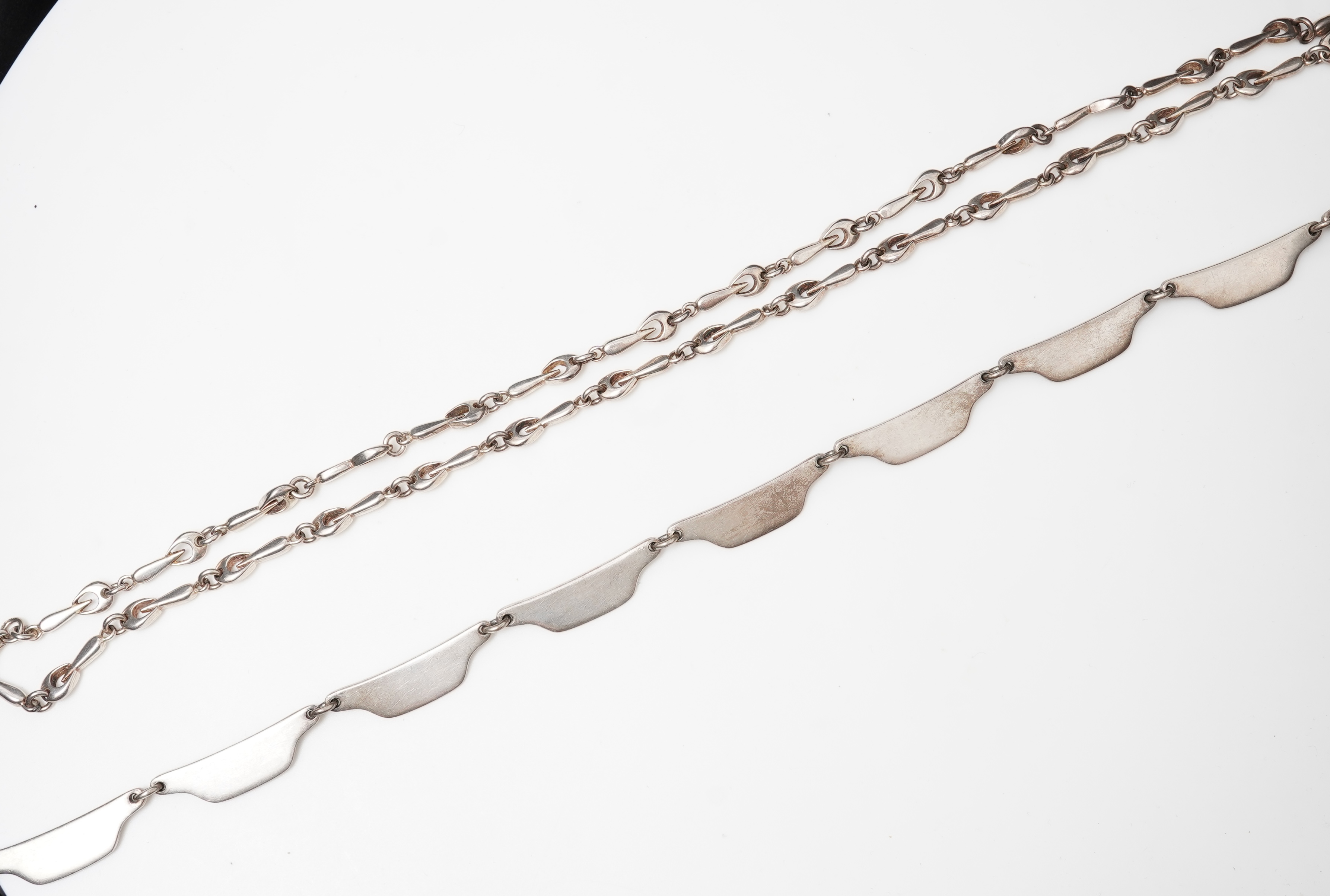 Bent Knudsen, a modernist silver necklace, Denmark, circa 1968, and a silver chain necklace